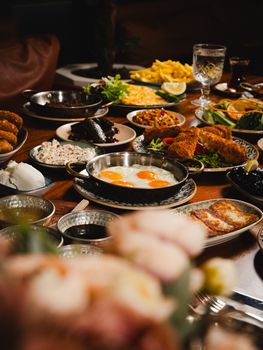 Delicious breakfast spread featuring eggs, meats, and sides set on a beautifully arranged table.