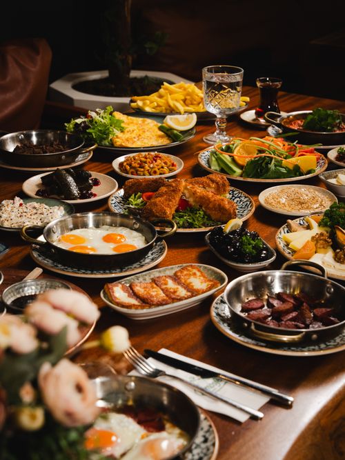 Free A rich and colorful Mediterranean feast with various dishes on a wooden table, perfect for gourmet dining. Stock Photo