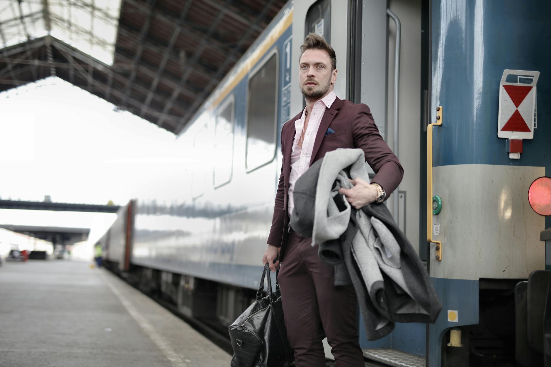 Serious stylish bearded businessman in trendy suit