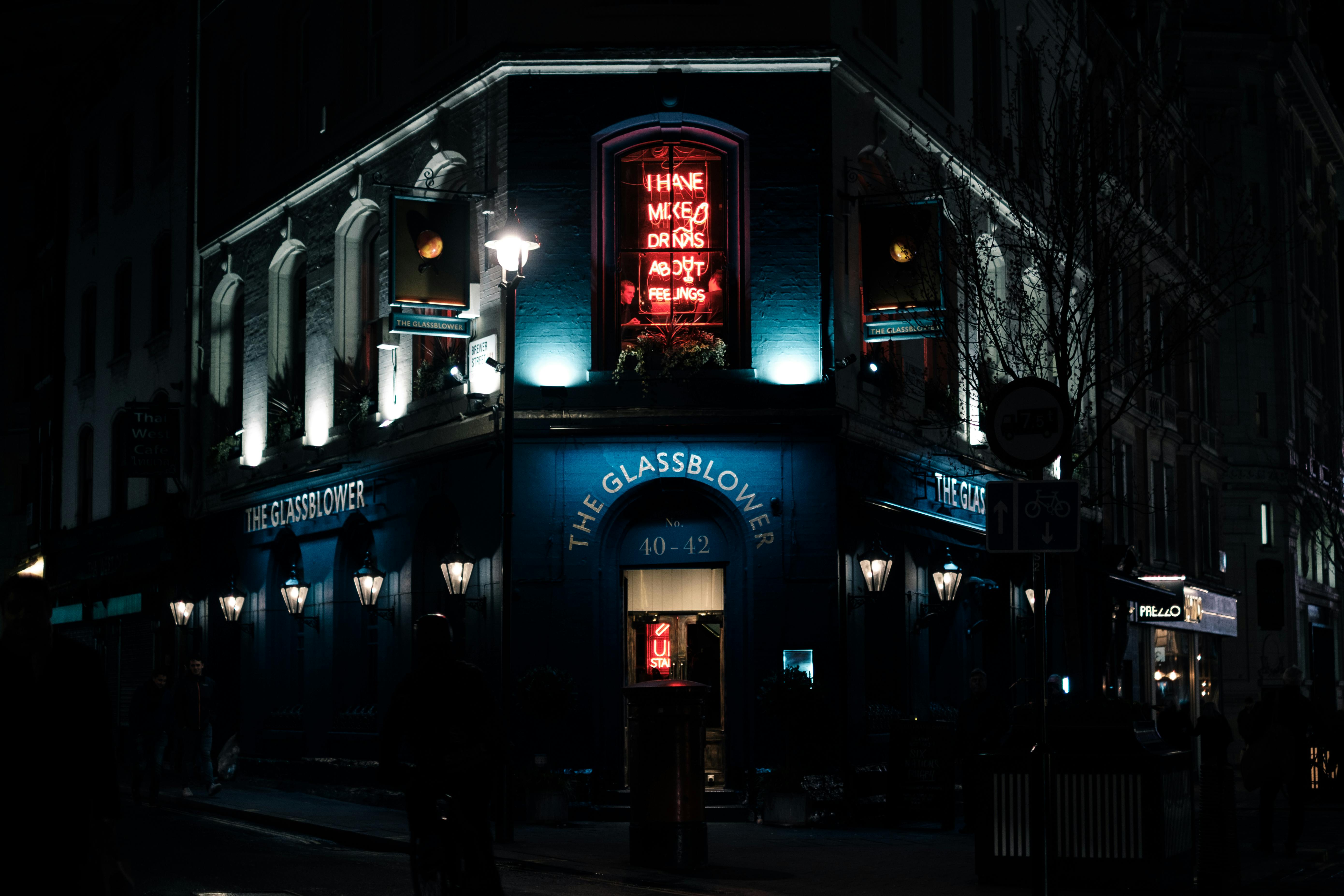 neon sign on illuminated building at night