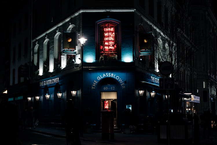 Neon Sign On Illuminated Building At Night