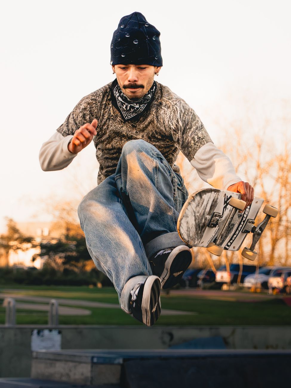 A skateboarder performs a mid-air trick in a sunlit Buenos Aires park, showcasing skill and style.. pexels, skateboarder, per
