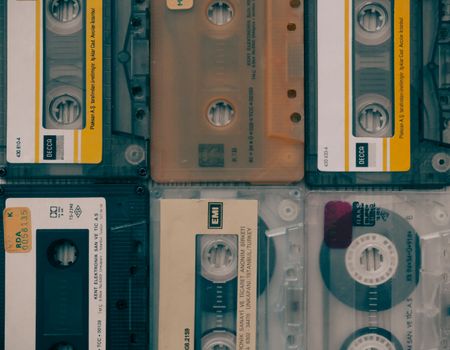A flat lay of assorted vintage audio cassettes, showcasing retro music media.
