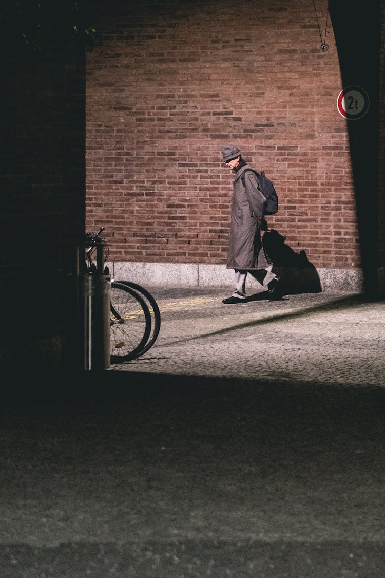 Elegant Man Walking On Street In City District