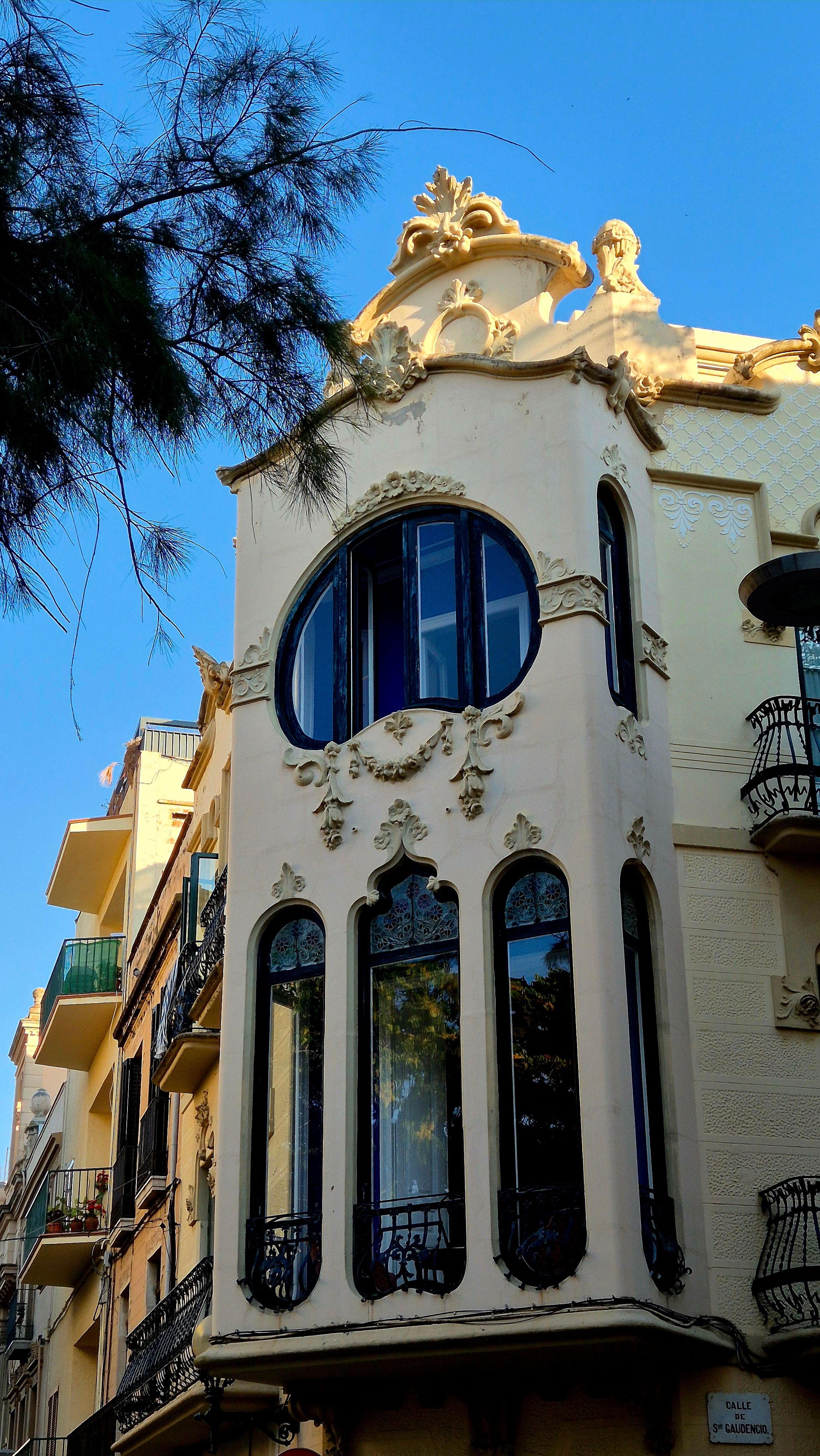 Art Nouveau architecture with ornate facade and large windows in daylight.. nouveau, architecture, with