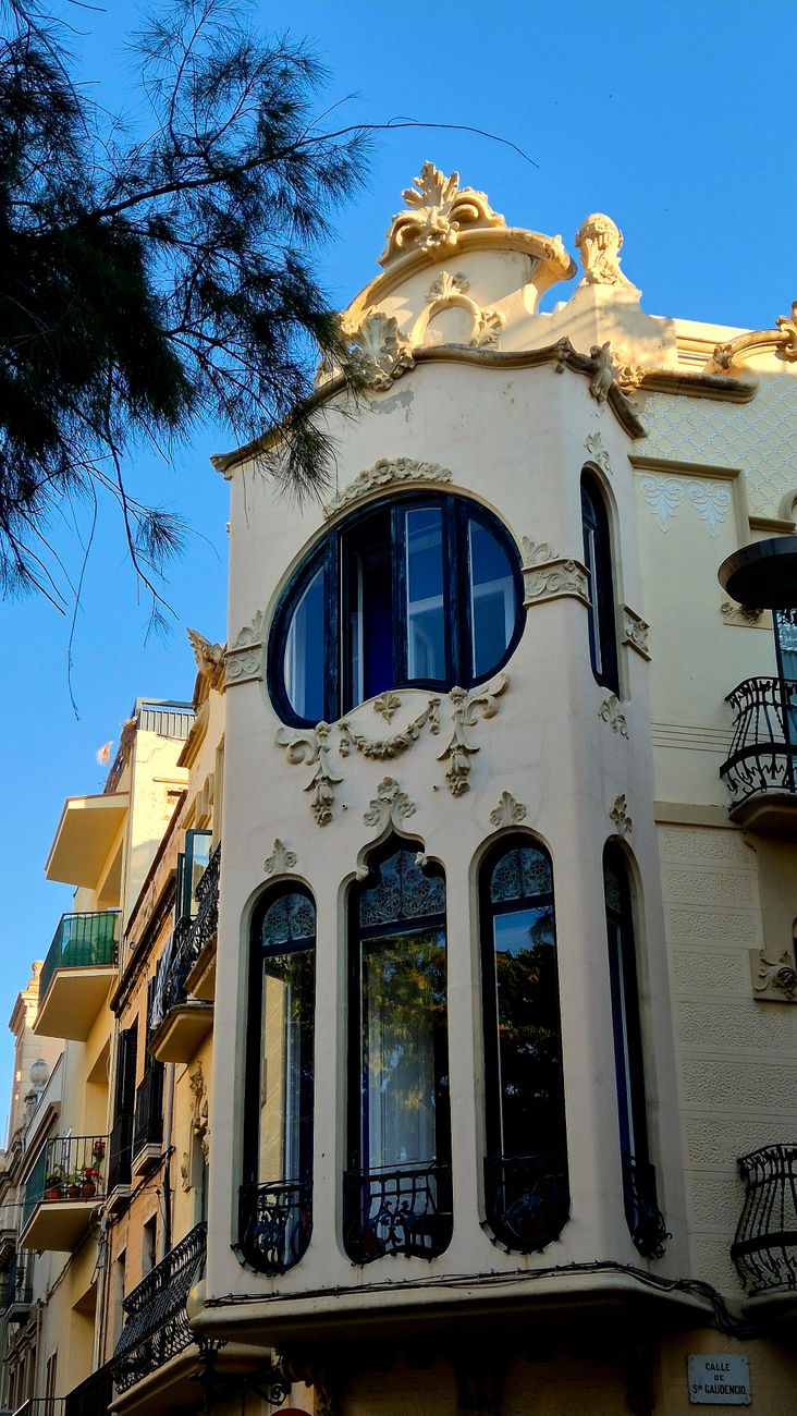 Art Nouveau architecture with ornate facade and large windows in daylight.. nouveau, architecture, with