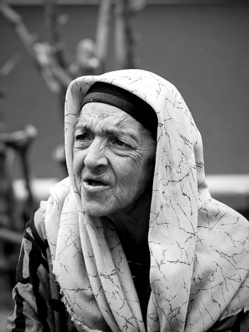 Free Black and white portrait of an elderly woman wearing a traditional headscarf, captured outdoors in İstanbul. Stock Photo
