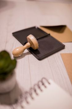 Wooden stamp on ink pad placed on desk