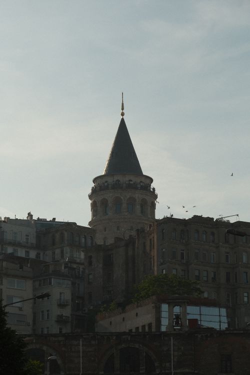 Free The iconic Galata Tower seen against a soft evening sky, a symbol of Istanbul's rich history. Stock Photo