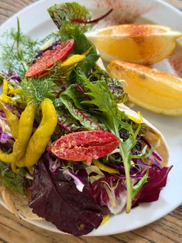 Vibrant vegetarian dish with leafy greens, citrus and spices, ideal for healthy diets.