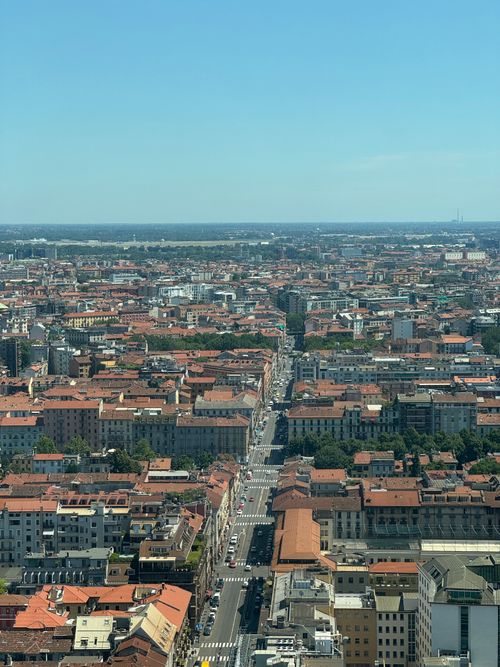 Free A sweeping aerial view of Milan's urban landscape, showcasing historic architecture and vibrant city life. Stock Photo