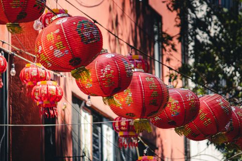 Free Colorful red Chinese paper lanterns adorn a street in Mexico City's Chinatown, capturing cultural fusion. Stock Photo