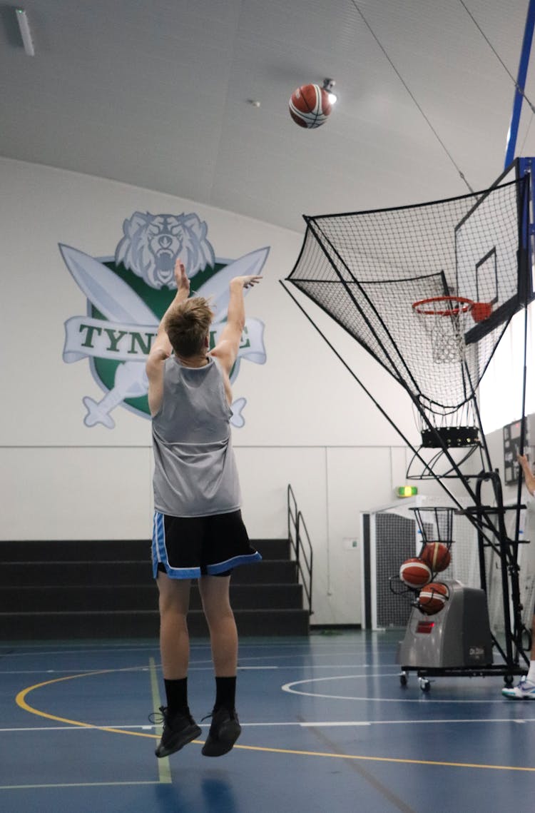 Person Shooting A Basketball