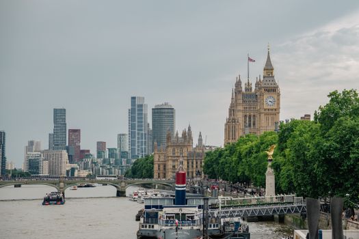 Captivating view of Big Ben and modern London skyline alongside the River Thames.