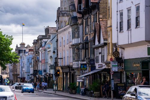 Free A lively street scene in historic Oxford, England, with classic architecture and vibrant activity. Stock Photo