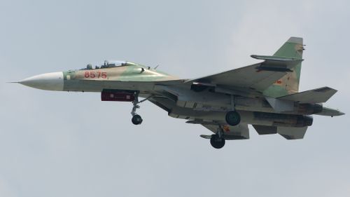 Free Close-up view of a military fighter jet flying through a cloudy sky. Stock Photo