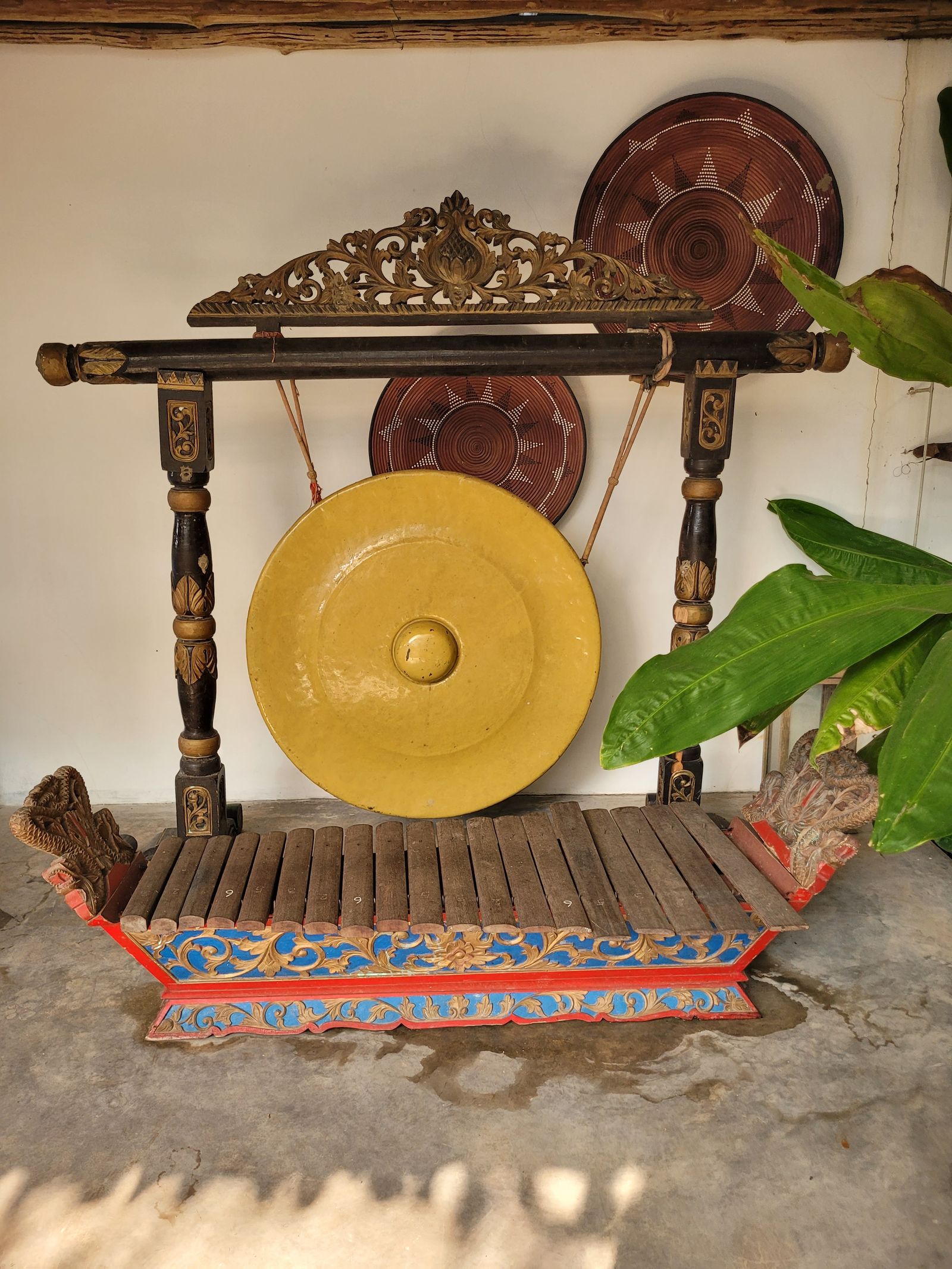 Ornate gong on a carved stand