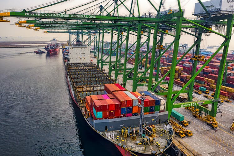 Blue And Red Cargo Ship On Dock