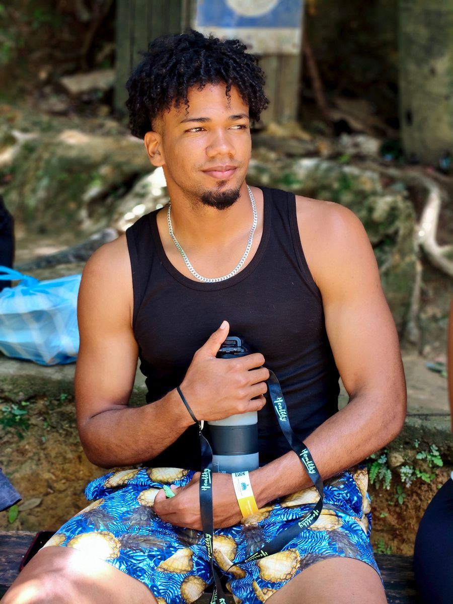 Young man relaxing outdoors in Samaná