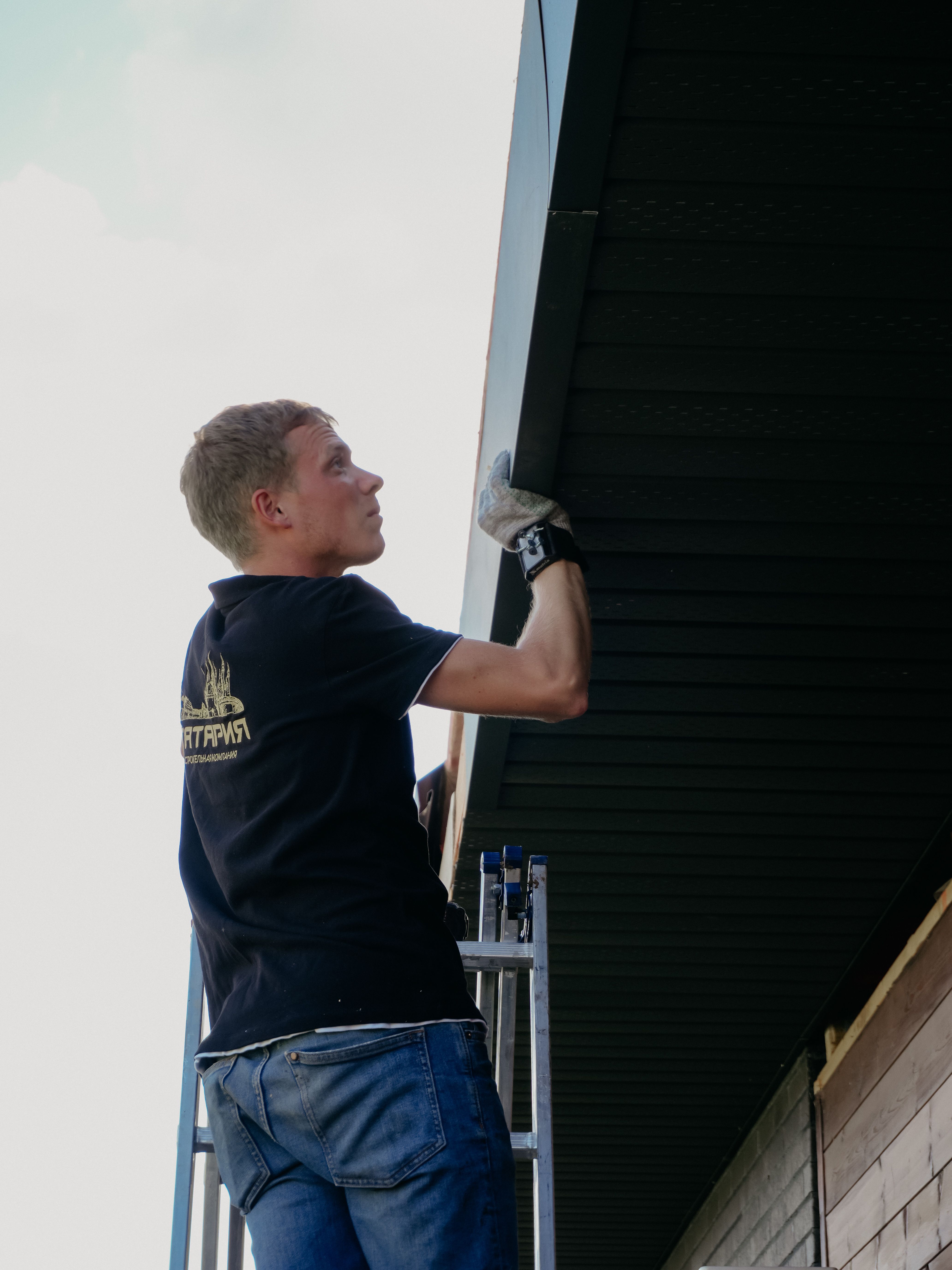 Fascia board and soffit being replaced under a roof eave