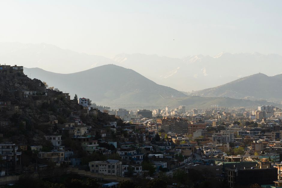 A stunning view of Kabul against a backdrop of mountains, capturing the city's architecture under a clear sky.