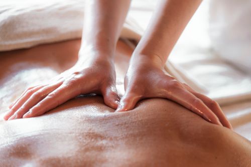 Free Close-up of a soothing back massage promoting relaxation and wellness. Stock Photo