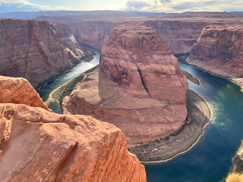 Free Breathtaking aerial photo of Horseshoe Bend, Arizona's iconic natural landmark with winding river. Stock Photo