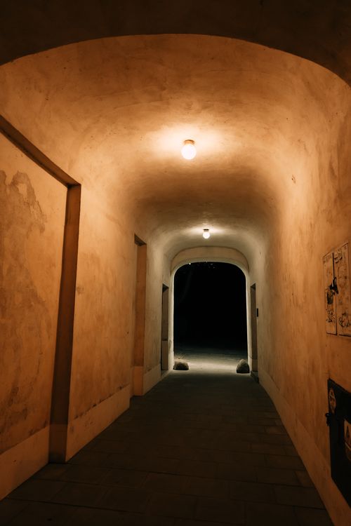 Free Quiet and atmospheric night-time corridor with warm lighting in Warsaw. Stock Photo