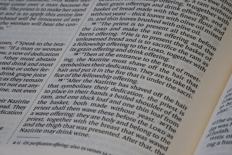 Detailed view of a Bible text open to a specific passage, showing the structure and content.