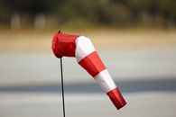 Red and White Windsock on Pole