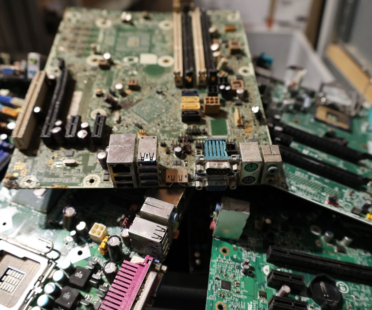 Pile of discarded circuit boards and electronic waste ready for recycling