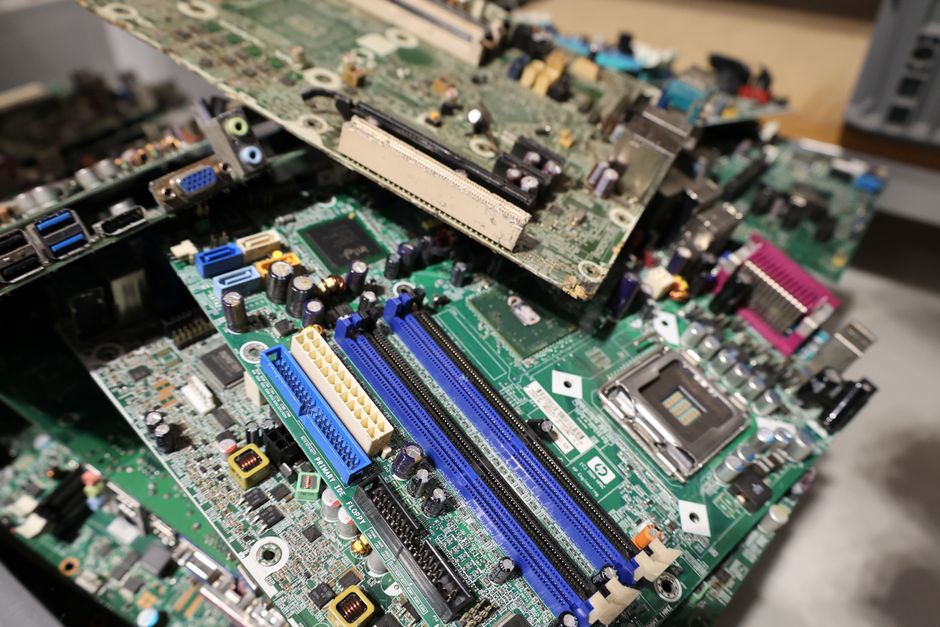 Stacked circuit boards representing e-waste recycling