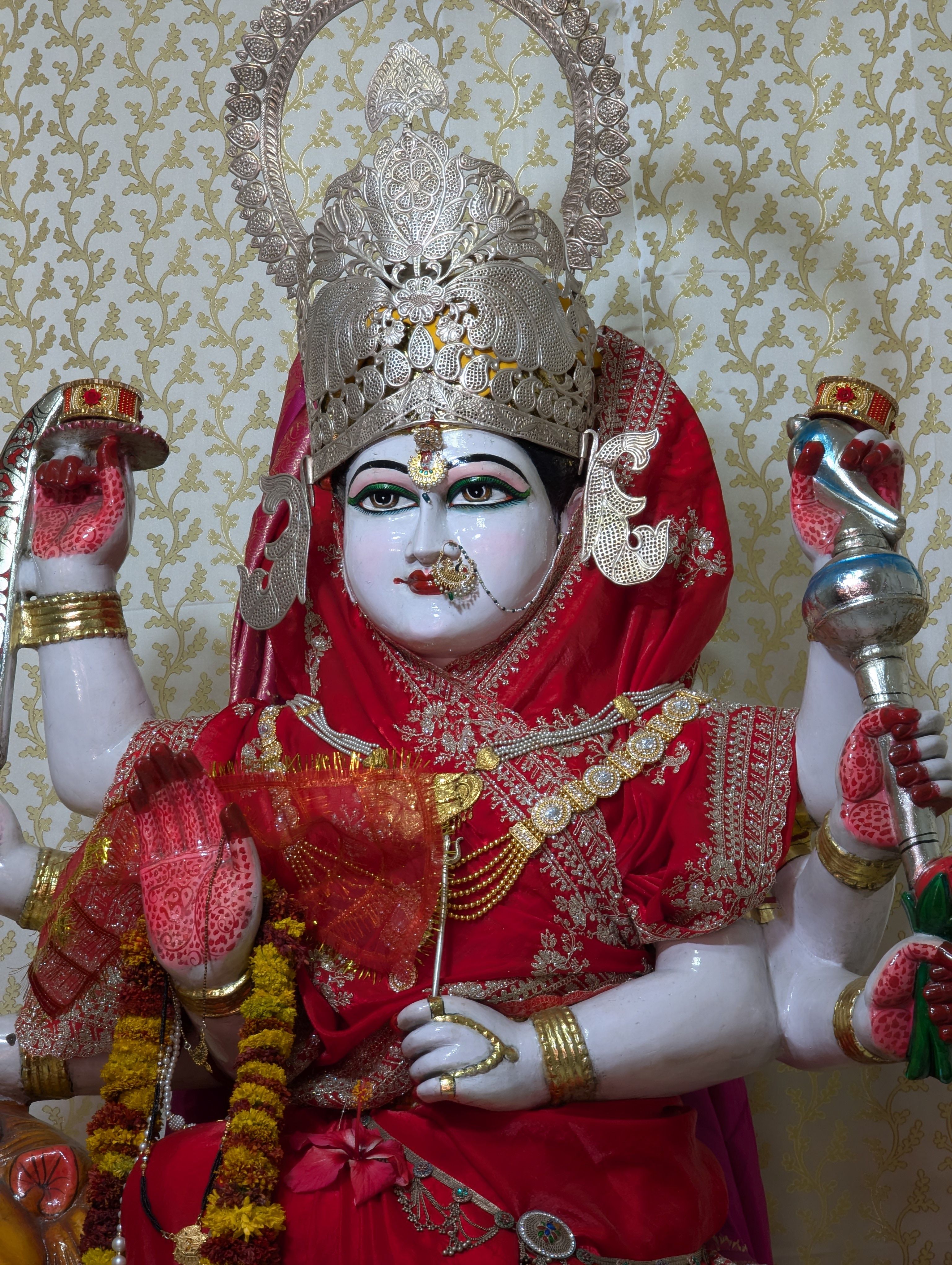 Intricate statue of a Hindu goddess in traditional attire, Jaipur temple, rich in cultural symbolism.