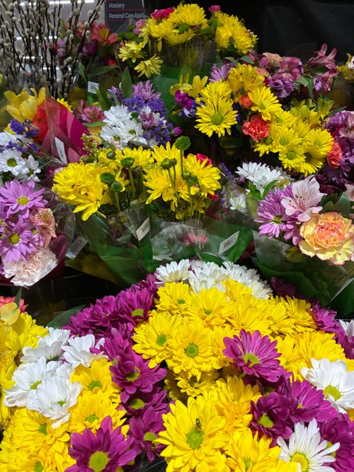 Free A colorful array of spring flowers including daisies and chrysanthemums in a vibrant bouquet arrangement. Stock Photo