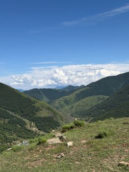 Breathtaking view of lush green mountains under a clear blue sky in Shanxi, China.