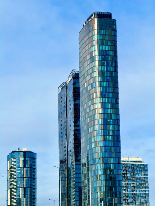 Free A view of sleek skyscrapers under a clear sky in Docklands, Melbourne. Stock Photo