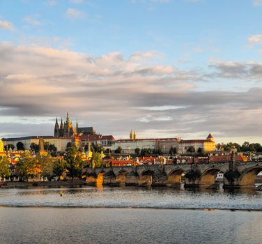 Charles Bridge at sunrise with a photographer — Prague