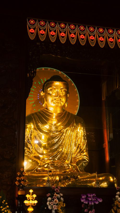 Free Radiant golden Buddha statue displayed in a temple in Ho Chi Minh City, Vietnam, showcasing exquisite craftsmanship. Stock Photo