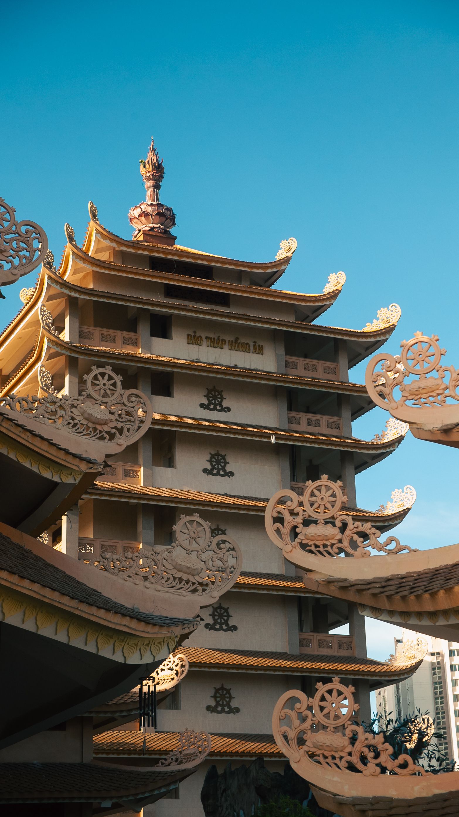 Elegant pagoda with intricate details captured in vibrant Ho Chi Minh City, Vietnam.