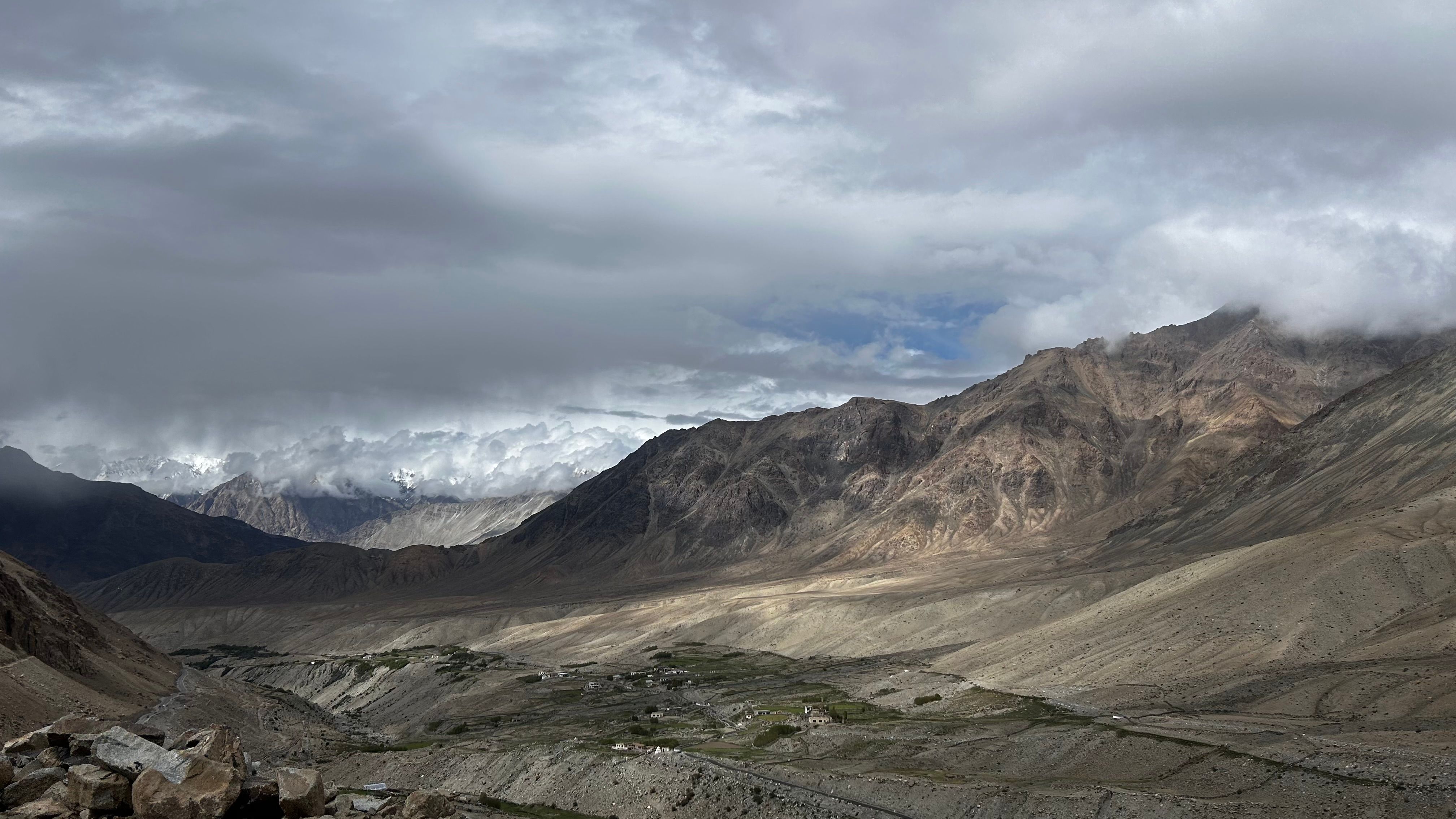 Stunning view of the rugged mountainous terrain under cloudy skies in Ladakh, India.