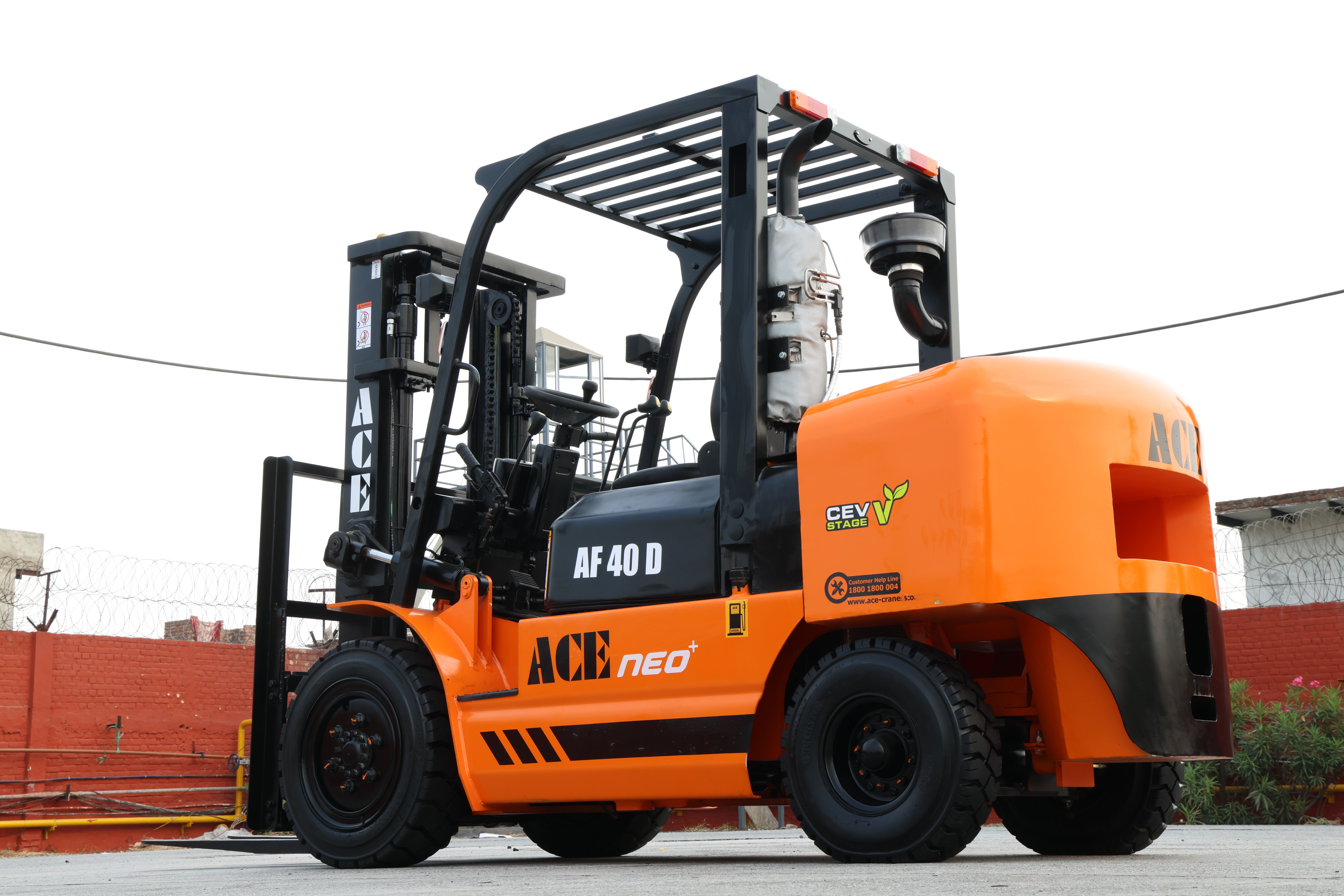 Orange ACE AF 40 D diesel forklift parked in an outdoor industrial area in India.