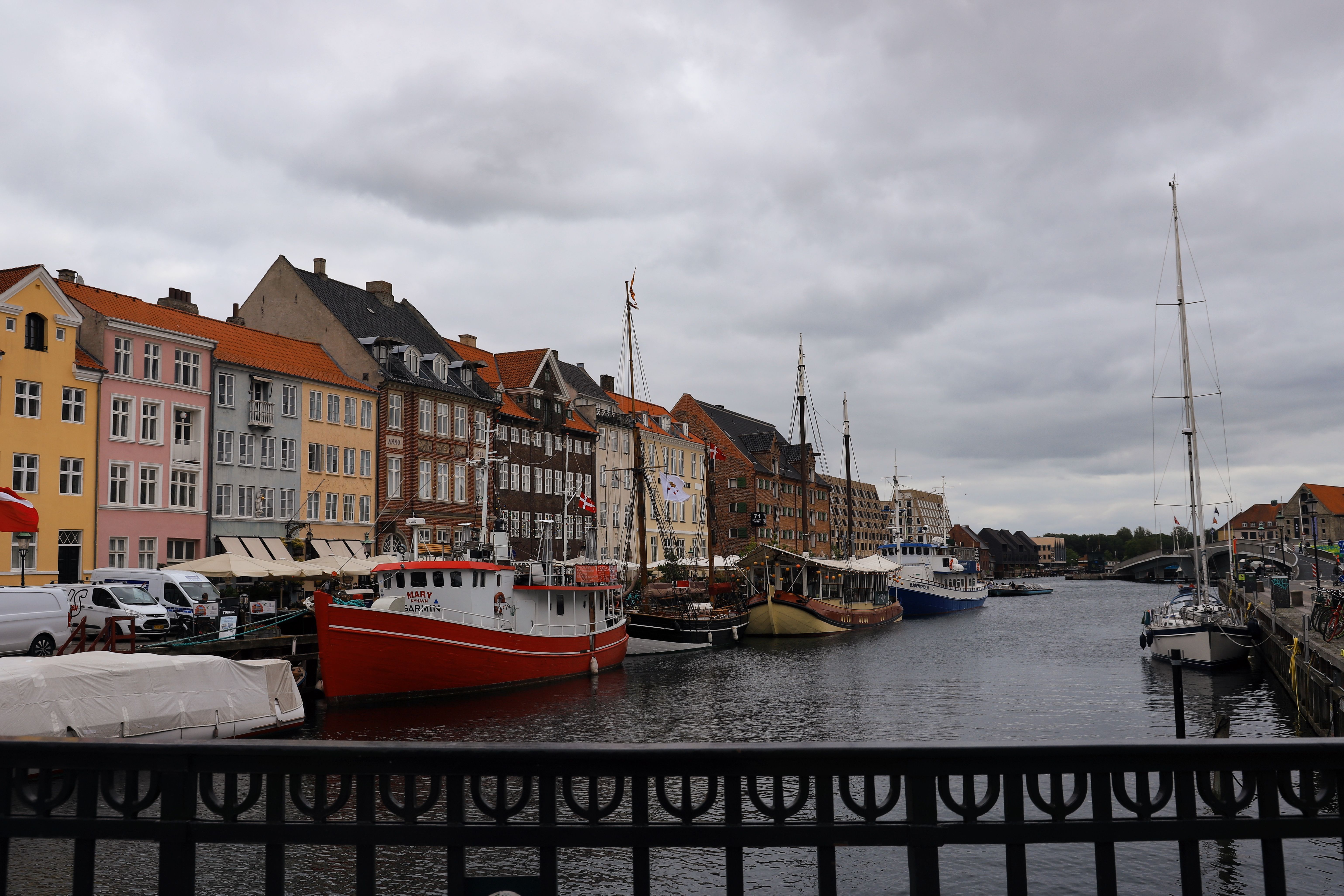 Colorful buildings and boats at Nyhavn harbor in Copenhagen, Denmark.