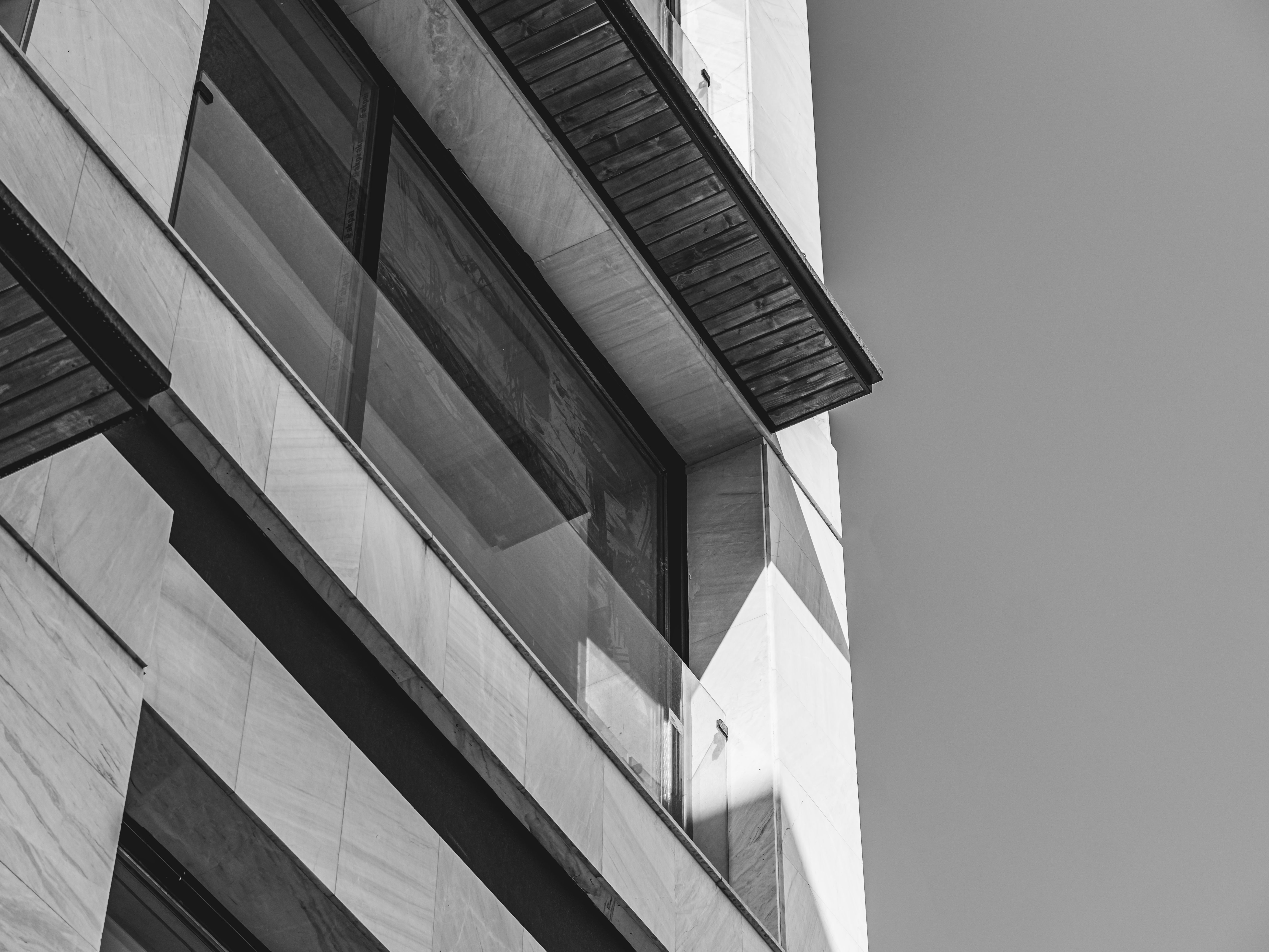 Black and white photo of a modern building facade in Tehran, showcasing geometric design.