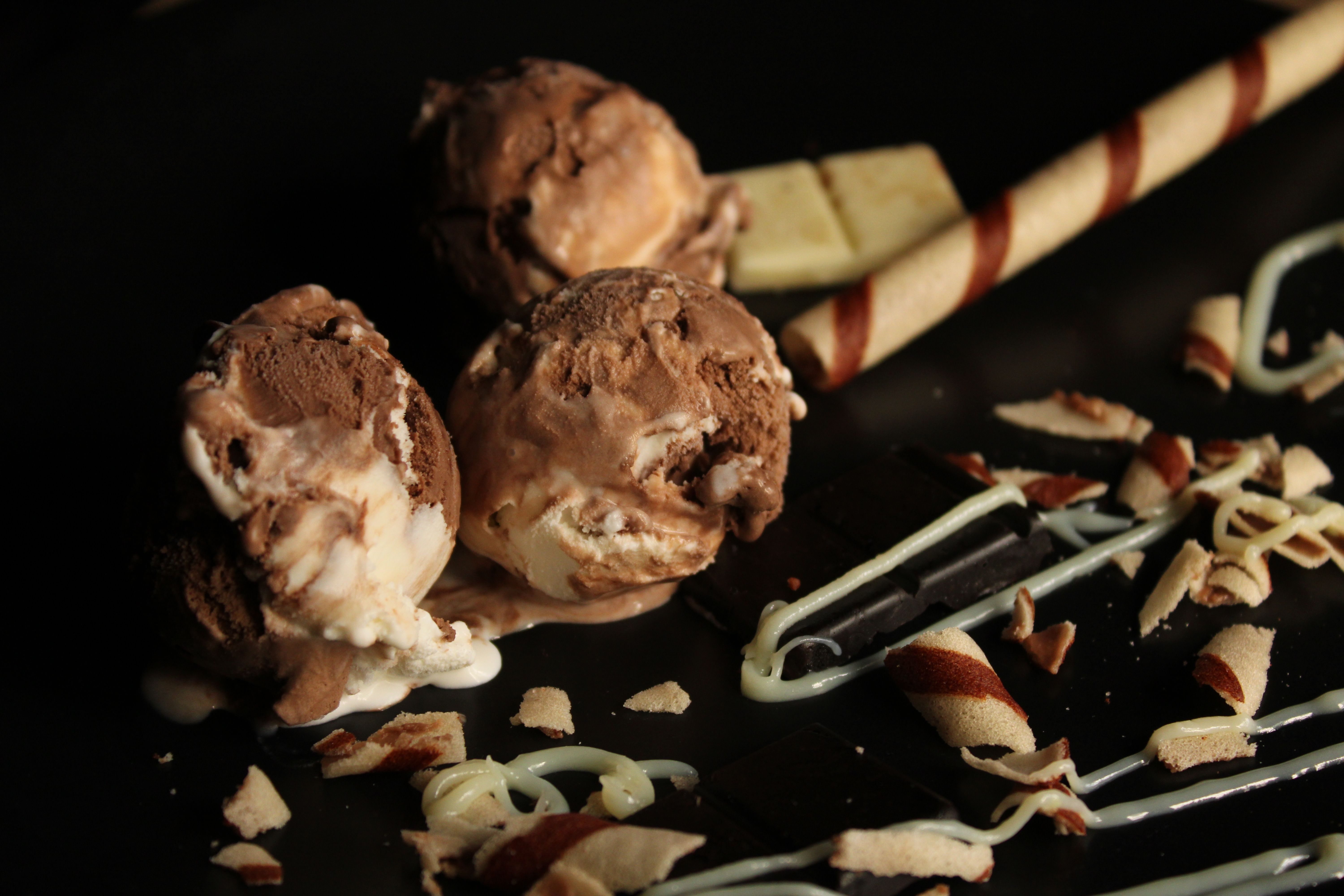 Rich dark chocolate gelato scooped into a cup