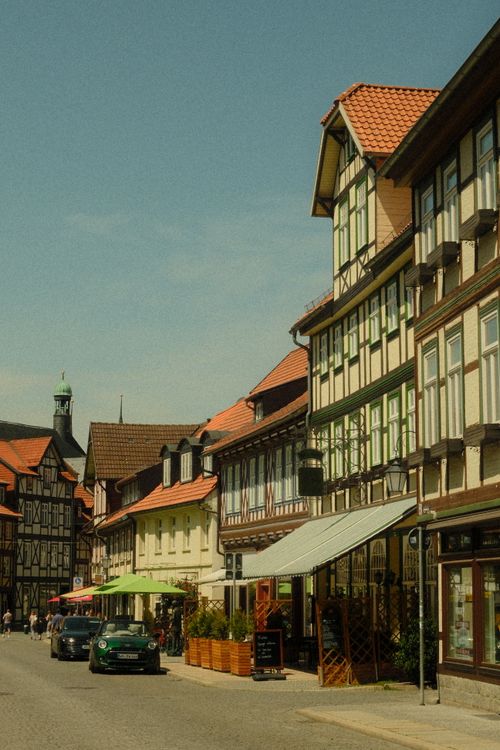 Free Explore the historic charm of Quedlinburg's half-timbered houses on a sunny day. Stock Photo