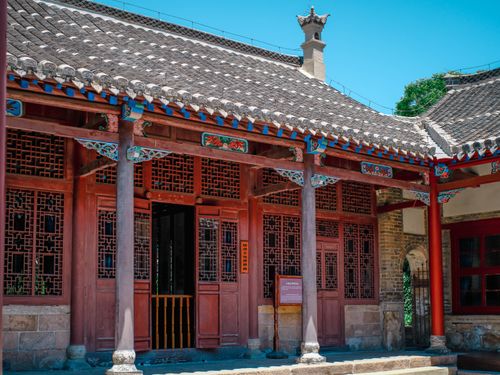Free Beautifully preserved traditional Chinese building with ornate wooden details under a clear blue sky. Stock Photo