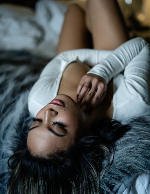 Free Woman Laying On Bed Stock Photo