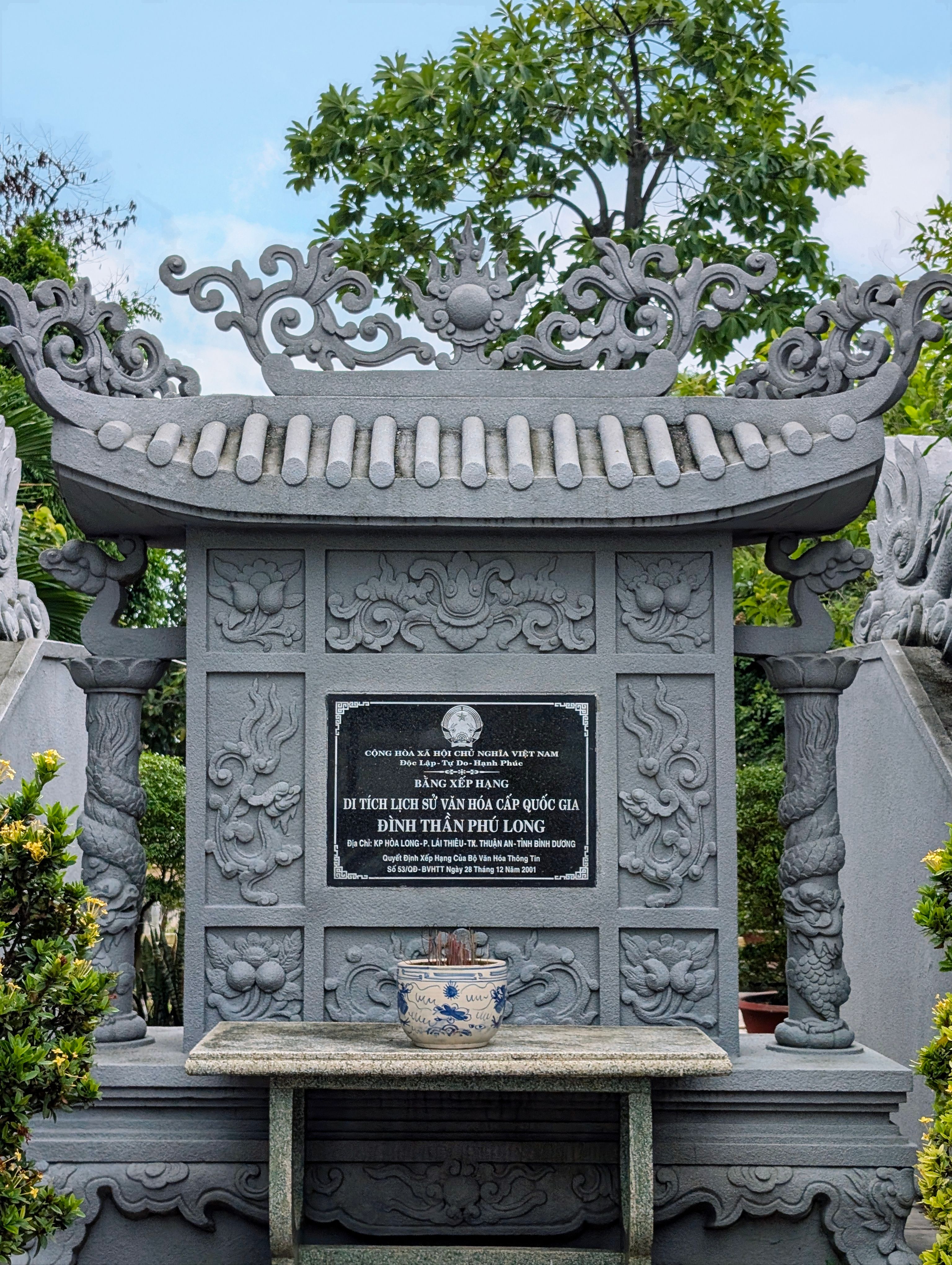 Intricate stone stele at Dinh Than Phuoc Long in Ho Chi Minh City, showcasing traditional Vietnamese design.