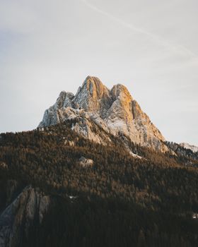 Captivating view of the Dolomites under a warm sunset, Trentino-Alto Adige, Italy.