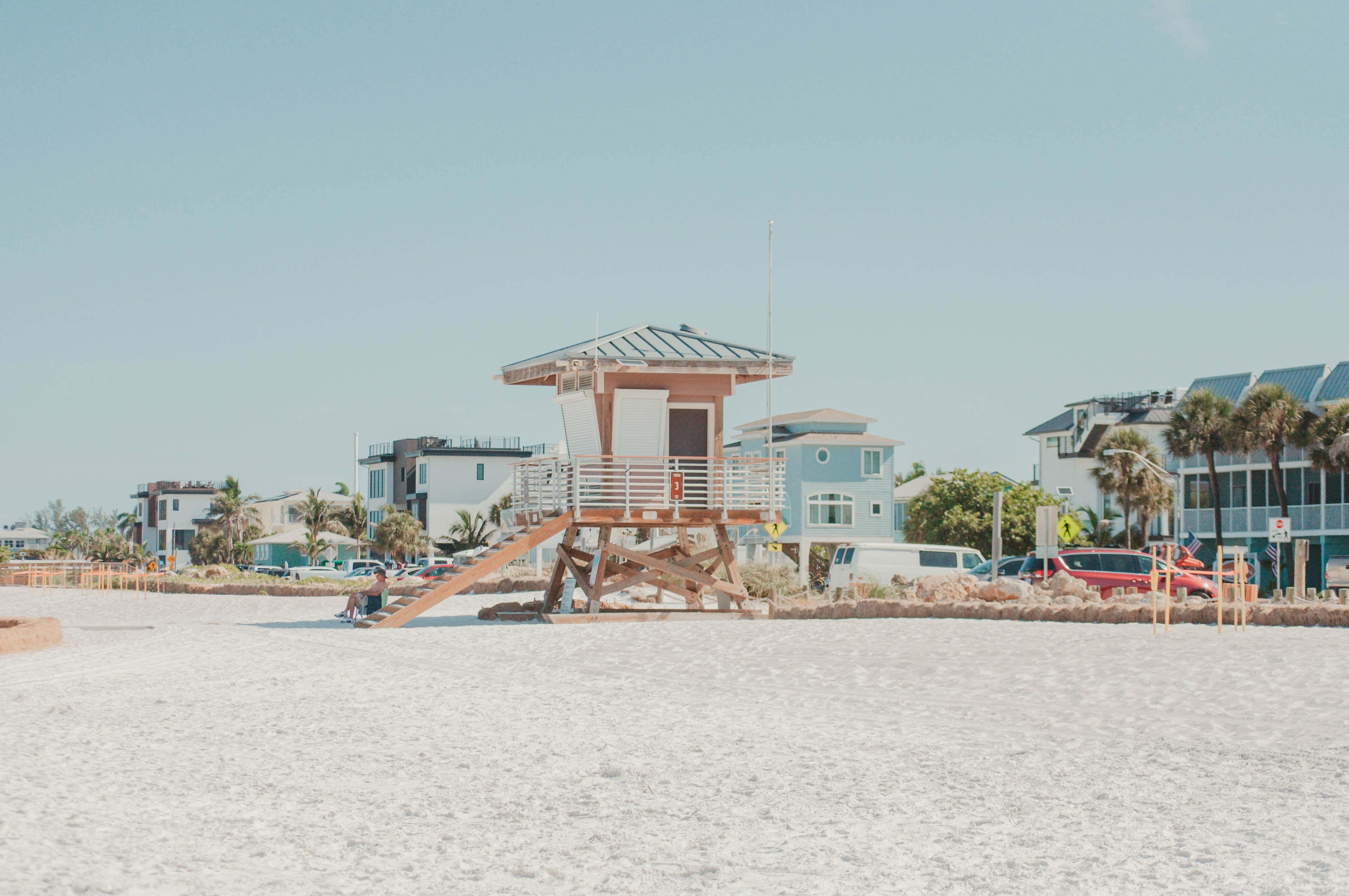Beachfront houses and lifeguard hut on the white sand Gulf Coast of Florida near Destin and 30A